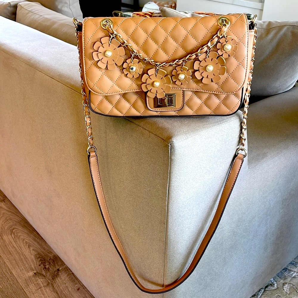 Quilted  purse with shoulder chain and strap .